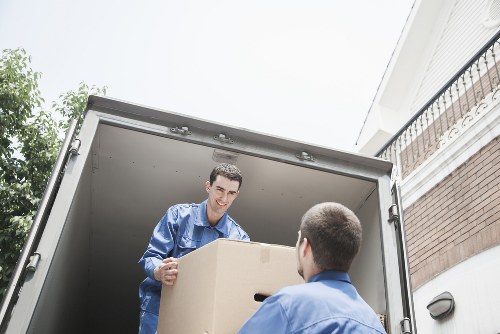 Professional movers handling furniture with care