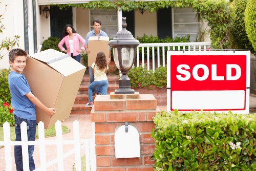 Moving team organizing and labeling boxes during relocation