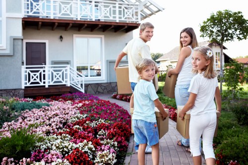 Crew removing furniture from flat on a busy Dulwich street